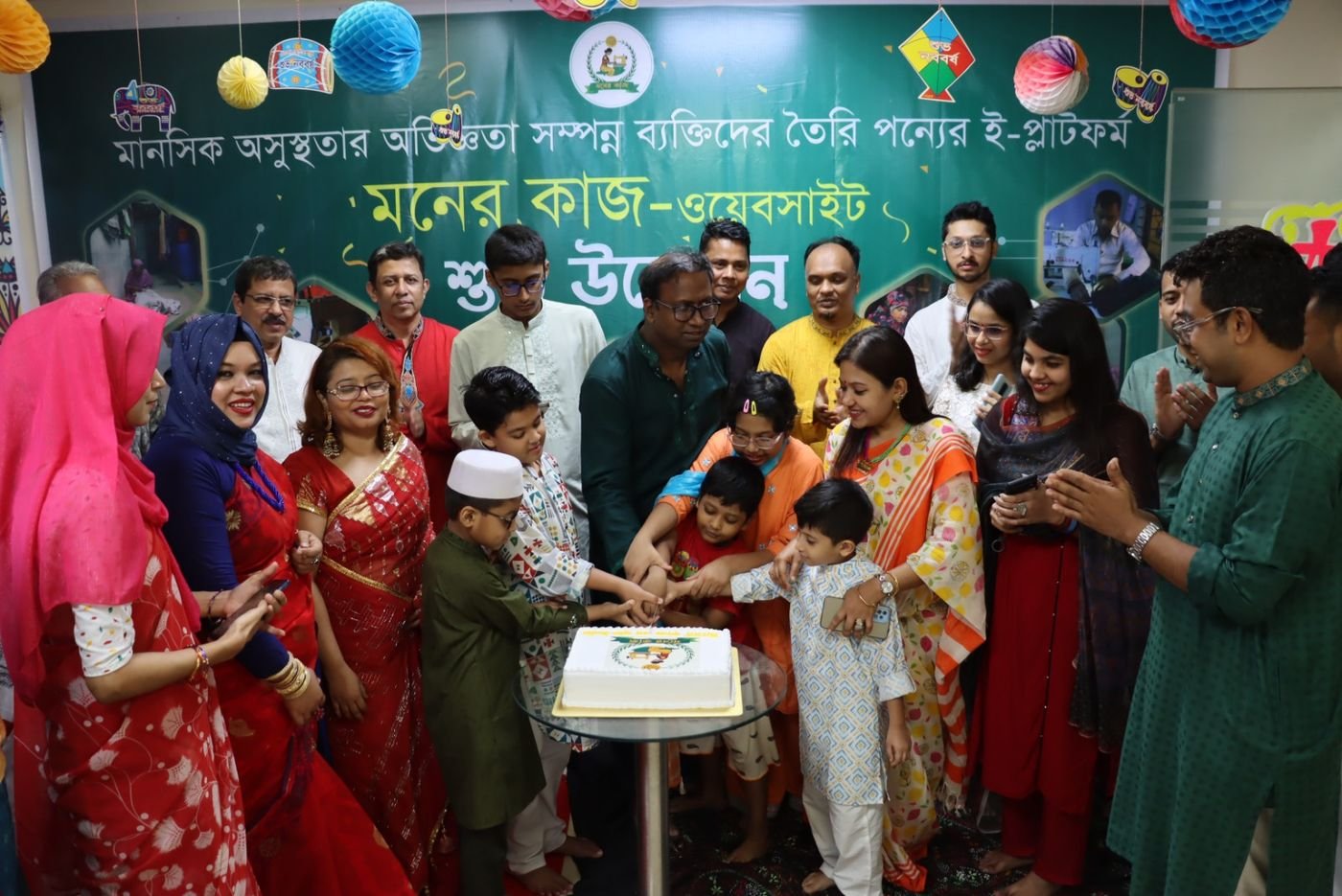 Cutting the cake at the Moner Kaj launch