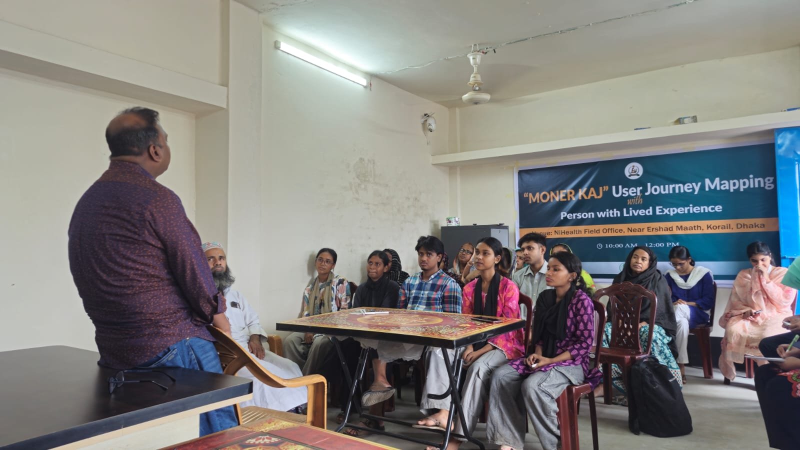 Participants at a Moner Kaj user journey mapping session with people with lived experience, at the NiHealth field office in Korail, Dhaka